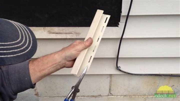 How do I attach a deck to vinyl siding?