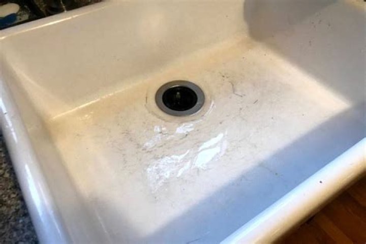How do you get black marks off a ceramic sink?