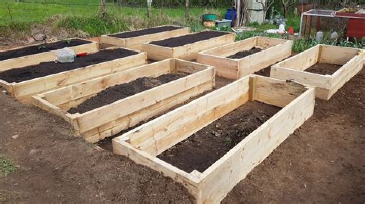 How do you prepare a raised vegetable bed for winter?