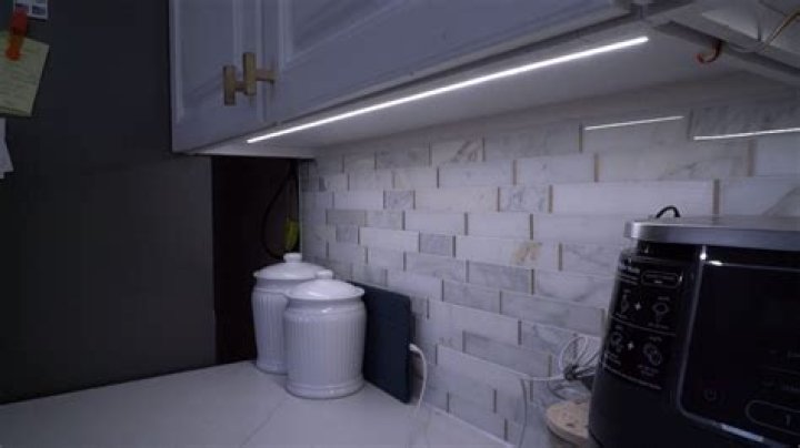 How do you run LED strip lights under cabinets?