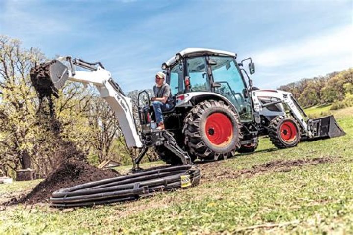 How do you use a backhoe tractor?