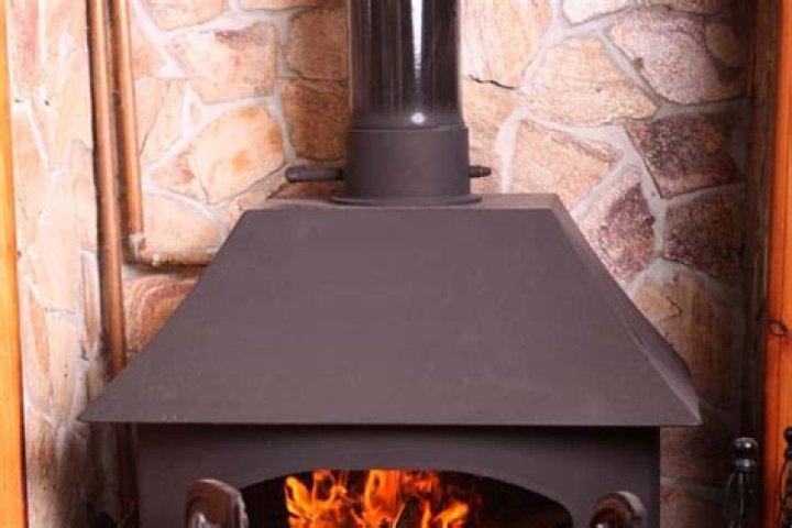 What does a damper on a wood stove do?