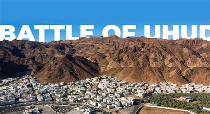 What was the main cause of the Battle of Uhud?