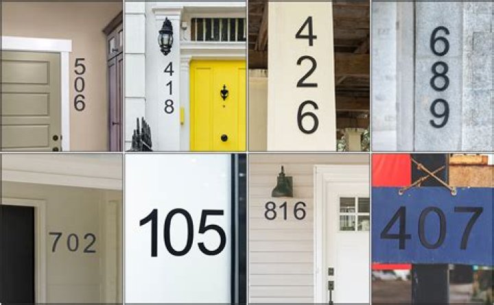 Where should house numbers be placed on a house?